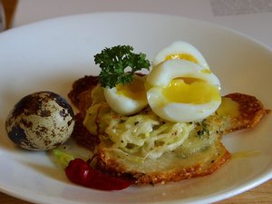 Potato galettes, served with quail eggs.