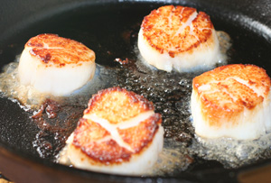 seared scallops in cast iron skillet