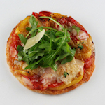 roasted tomato tart with parmesan cheese and arugula