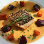 Wild striped bass with miso butter sauce, roasted carrots and beets